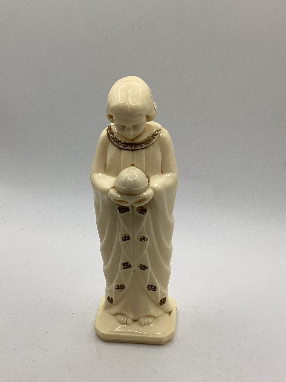vintage ivory-colored religious plastic or celluloid figurine 5.25”